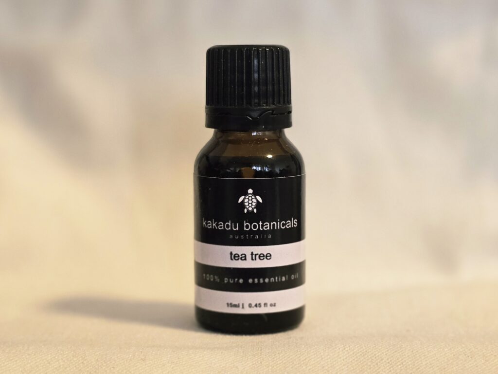 Tea Tree Essential Oil by Kakadu Botanicals - minimalist, premium, natural Australian brand aesthetic.